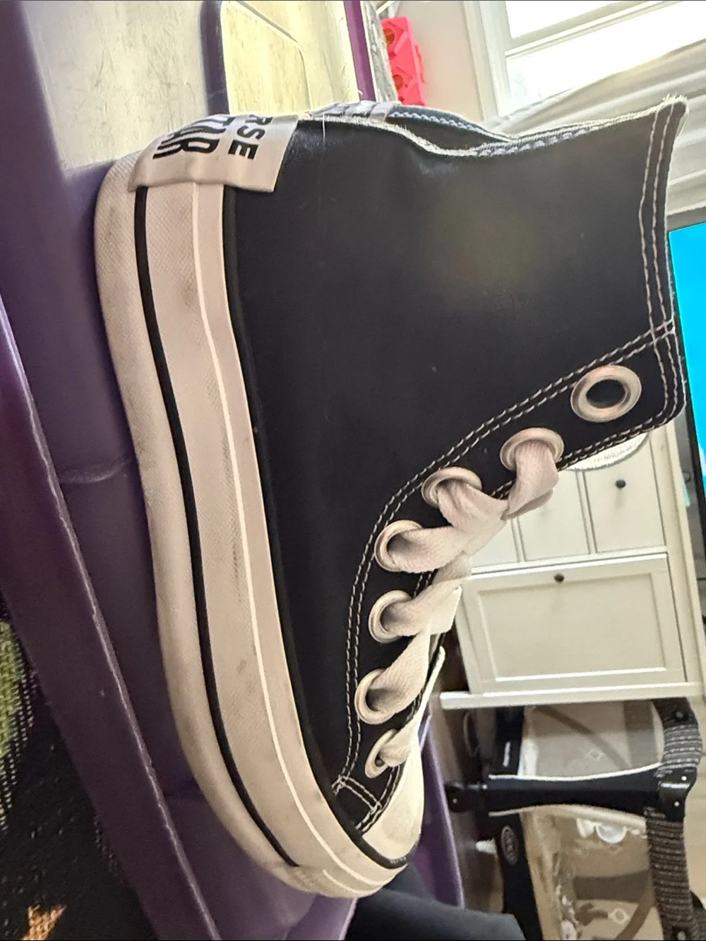 Converse women’s Black and White High-Top Sneakers